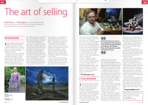 A spread from Art Business Magazine titled 'The Art of Selling' showing a short white woman holding a colourful abstract painting in a garden, beside a painting of Arcadian standing stones at night.