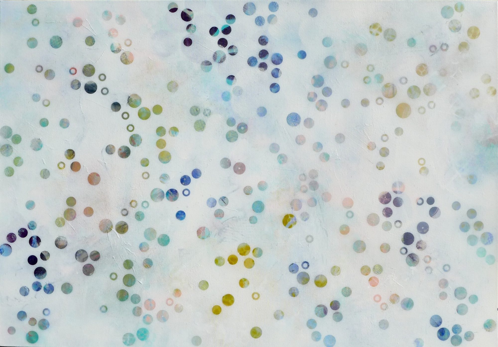 A landscape oriented canvas with mottled whit ground with small scale dots of different sizes scattered around the space, in navy blue and soft ochre yellow, pale blues, greens, greys and pale pinks.