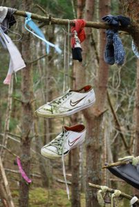 Dangling trainers at the Clootie Well